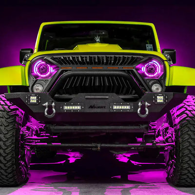 Front view of a yellow Jeep with 7" Oculus Headlights installed, set to pink LEDs.