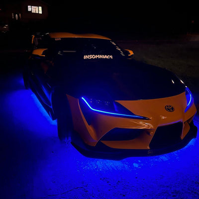 Under Glow LED Strip Kit RGB+W on an orange and black car