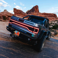 Rear view of Jeep Gladiator JT with Racetrack Tail Gate brake light on