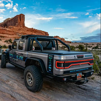 Rear view of Jeep Gladiator JT with Racetrack Tail Gate brake light on